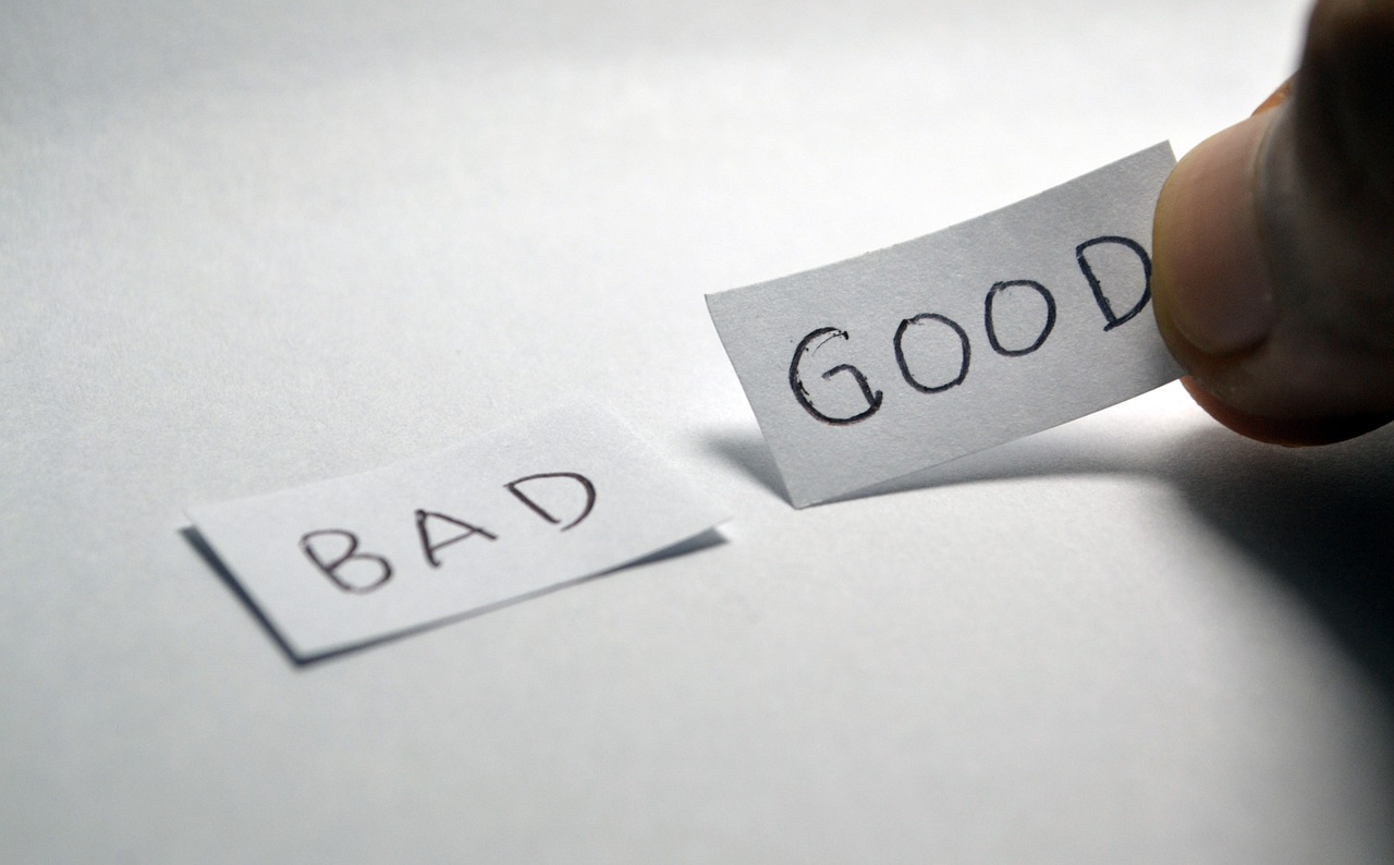 Good and bad written on a small white paper