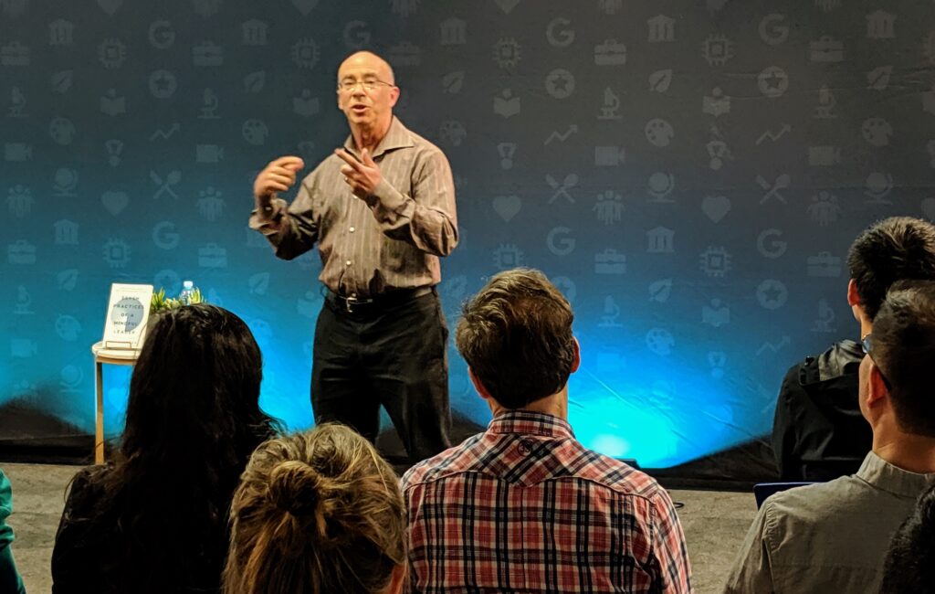 A man standing in the middle of a starry night