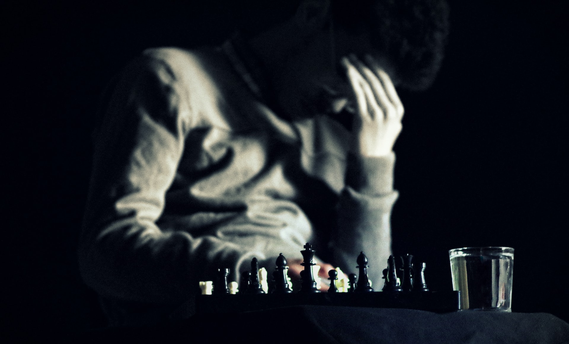 A man thinking hard on his next move on chess